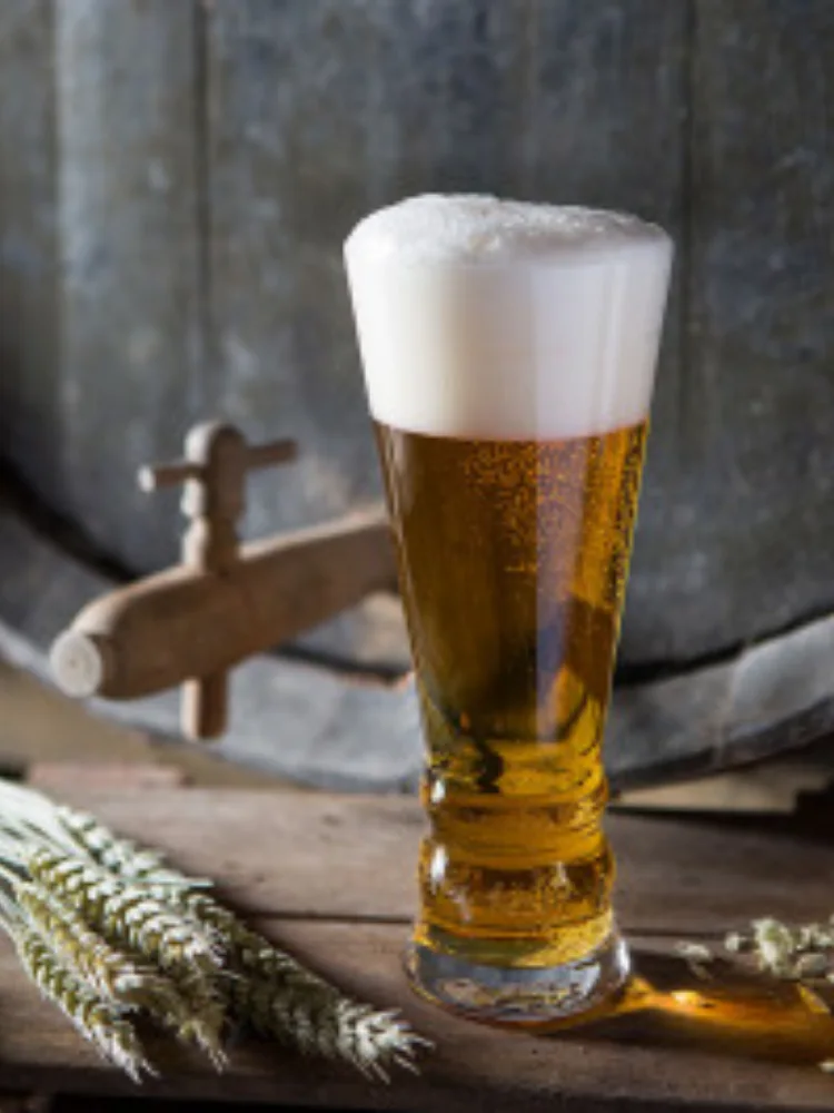 A tall flared Dartington pilsner glass