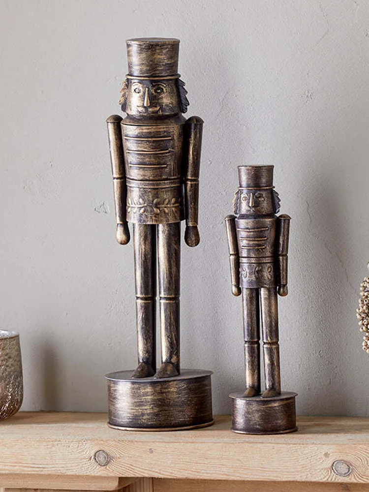 A Nkuku Imay antique brass nutcracker decoration