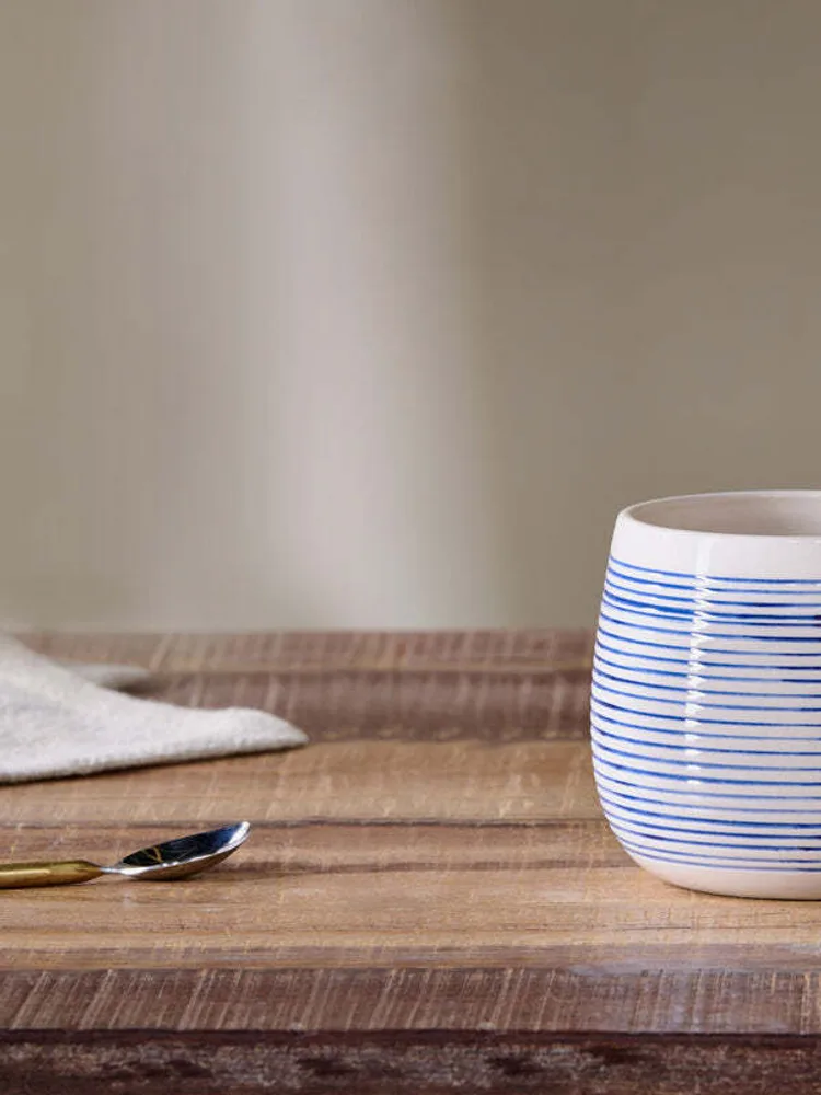 A large Nkuku Lin blue and white mug
