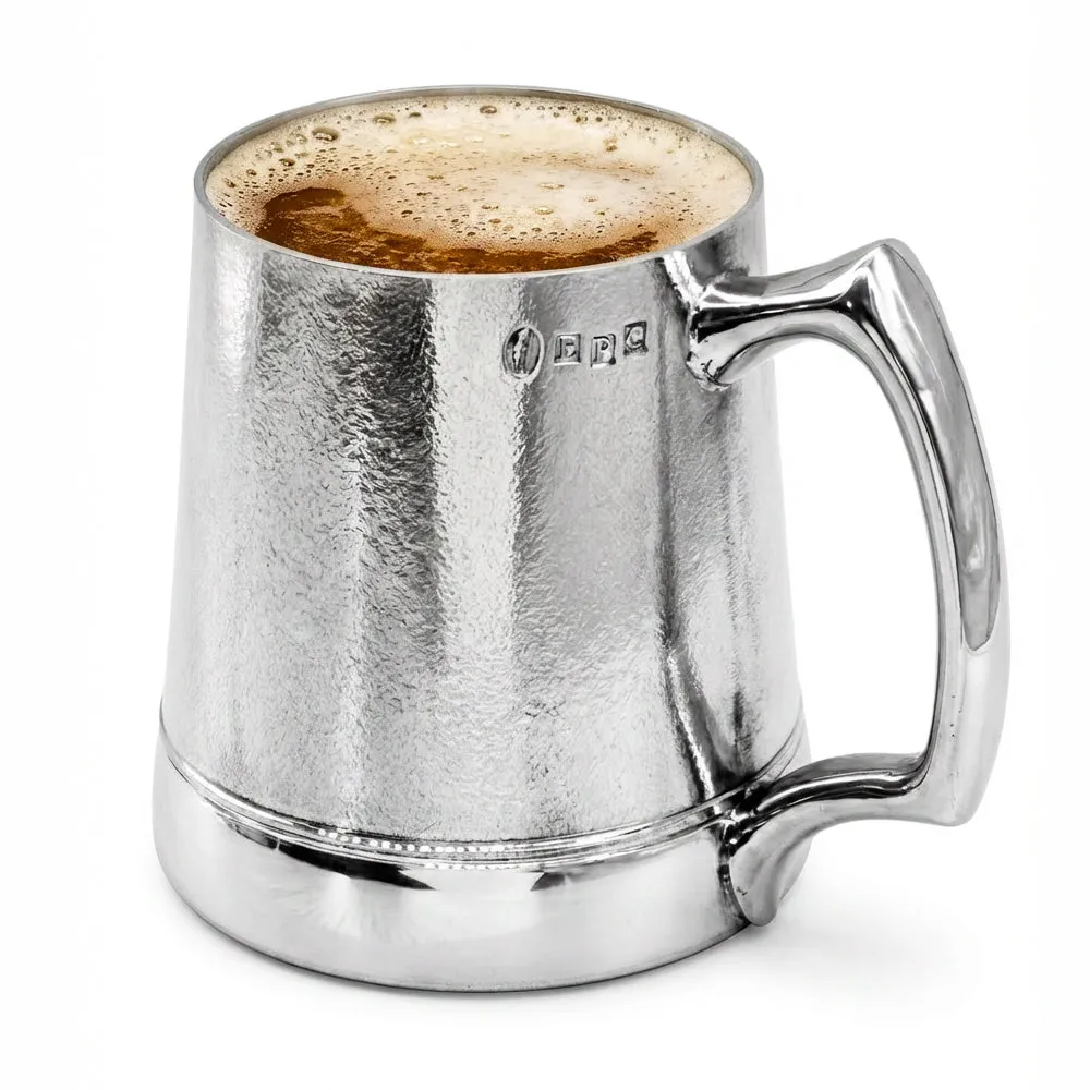 A polished Legacy one pint pewter tankard