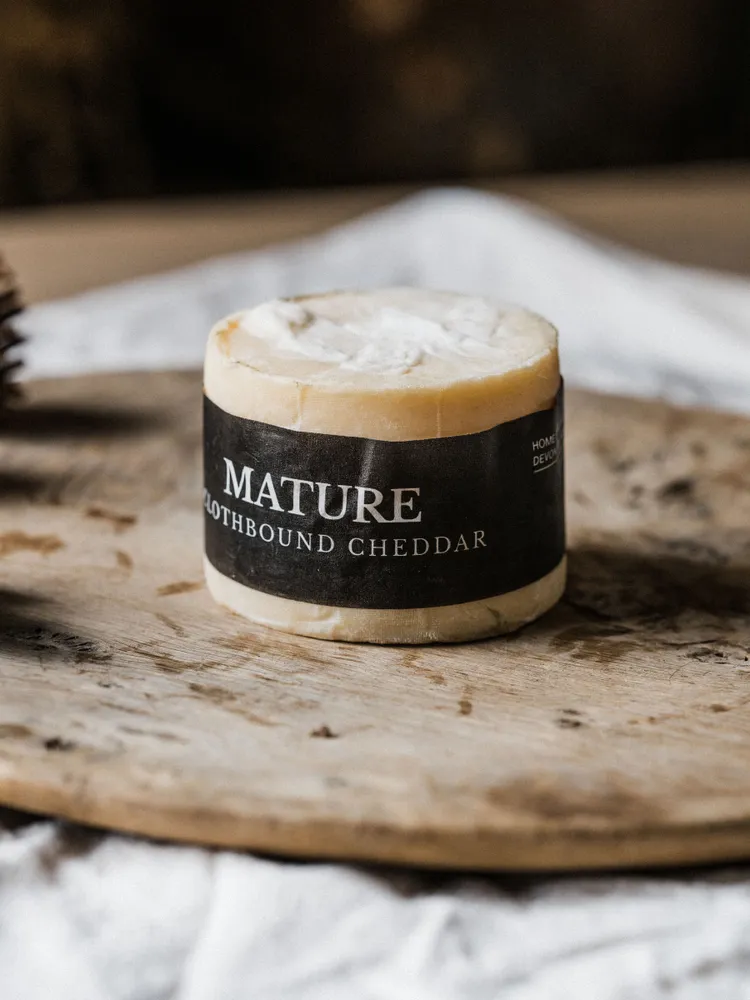 A mini truckle of Quicke's clothbound cheddar