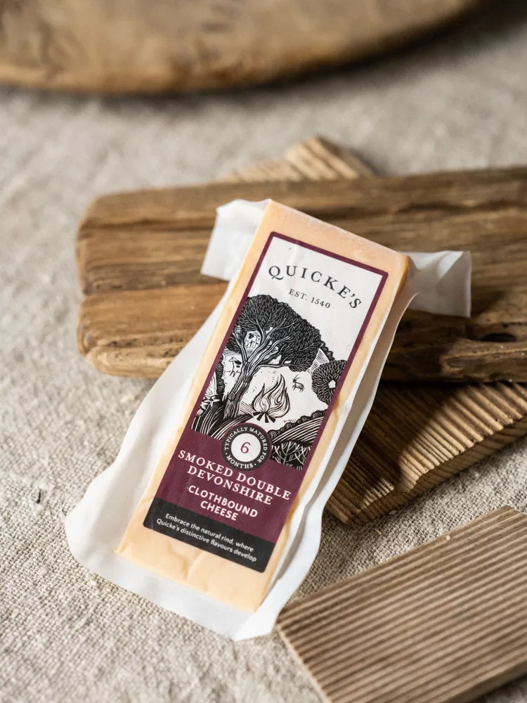 Quicke's Smoked Double Devonshire cheese wedge