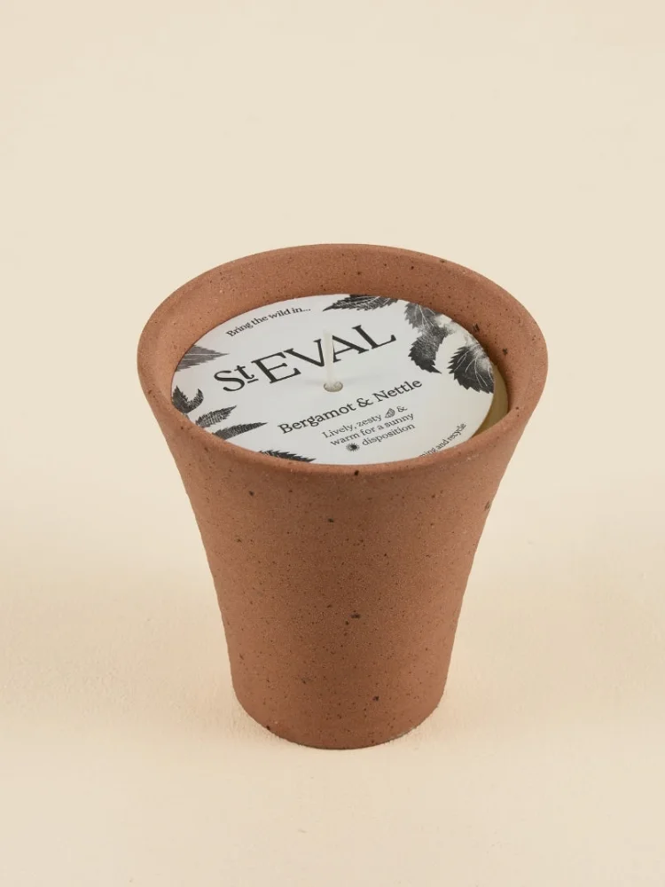 A St Eval Bergamot and Nettle candle in a speckled stoneware pot