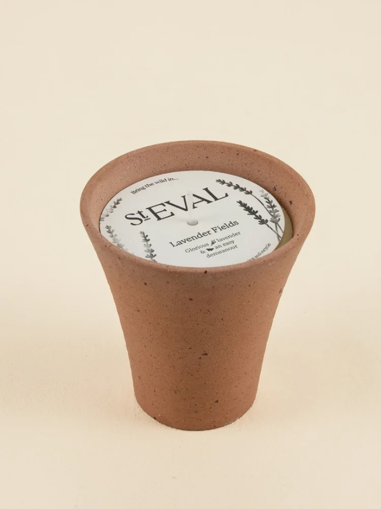 A St Eval Lavender Fields candle in a stoneware pot